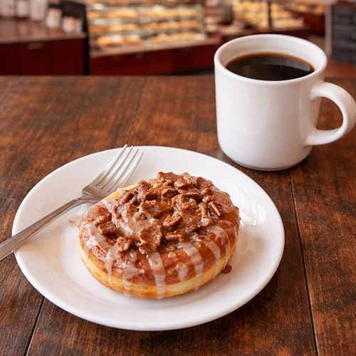 caramel nut roll and coffee